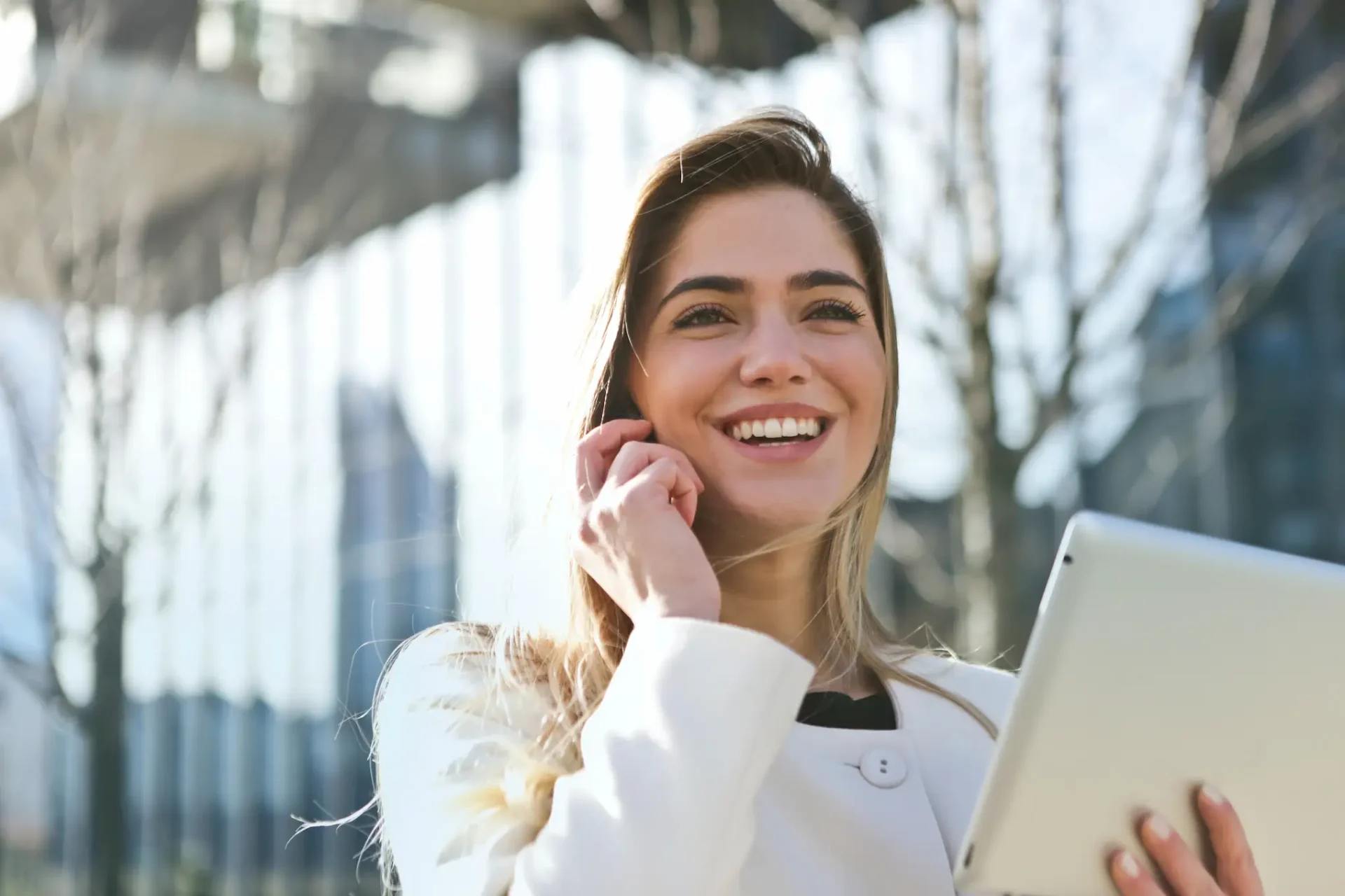 businesswoman on cell phone with laptop