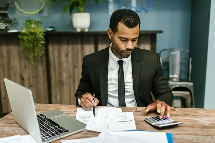 business man using calculator